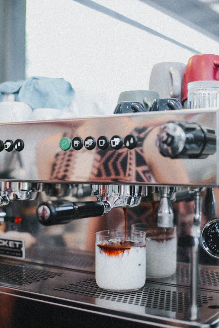 Close-up view of espresso being made with a coffee machine for a fresh drink experience.